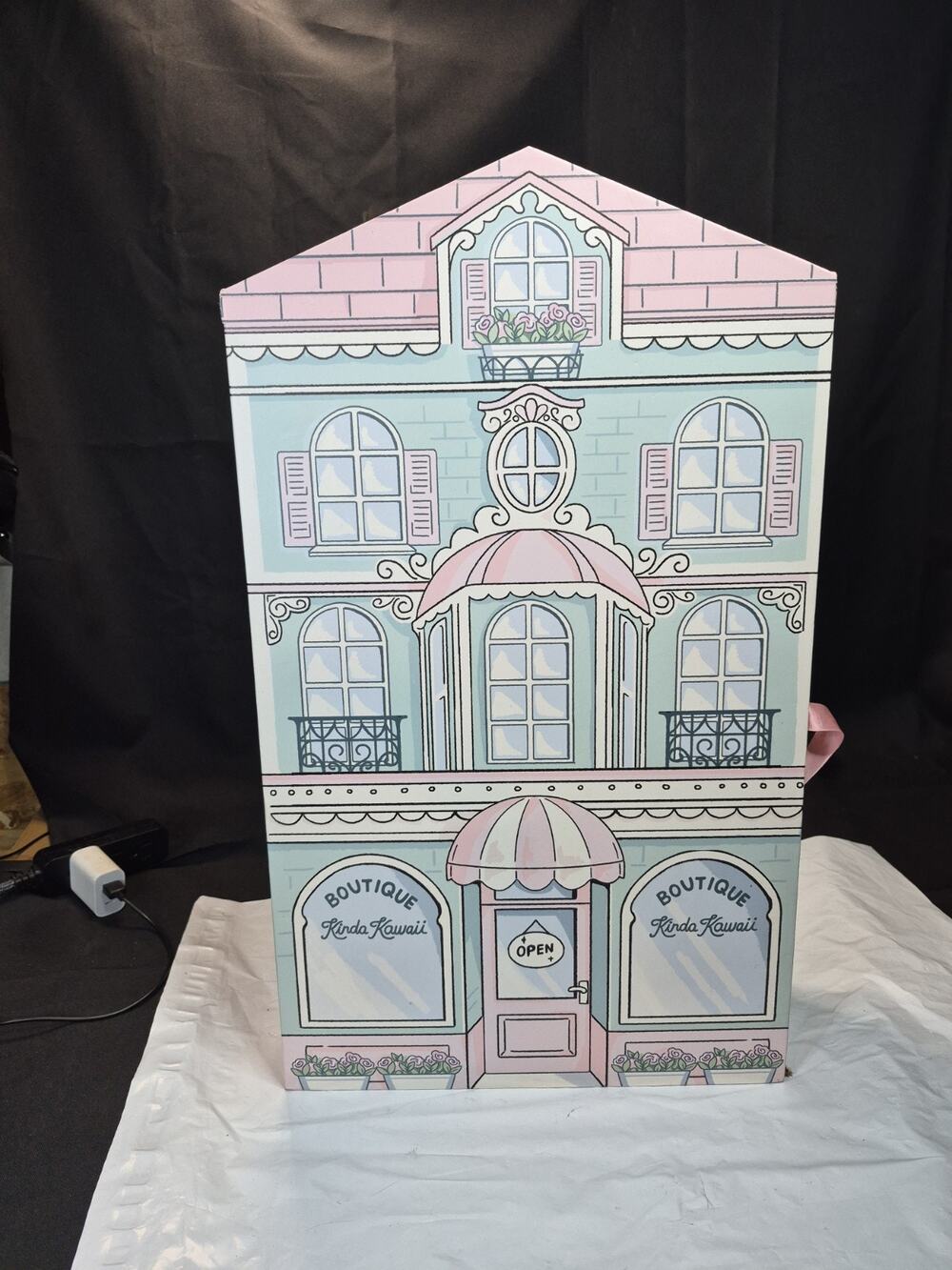 Cardboard doll house , Has Shelving And storage On The Inside. Spacious & Clean
